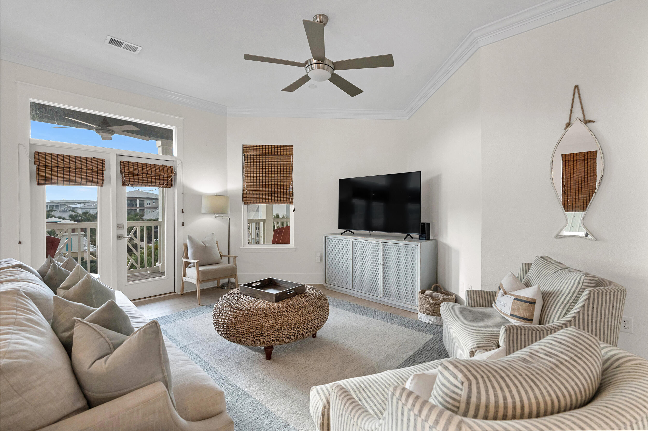 61 West Cobia Run, Unit 102 Inlet Beach, FL 32461 - Photo 5 of 37 a living room with furniture and a flat screen tv