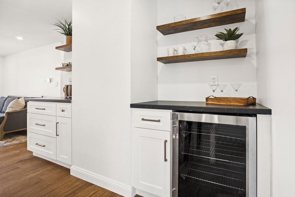 4 Jethro Street Maynard, MA 01754 - Photo 14 of 29 a kitchen with a stove and a cabinet