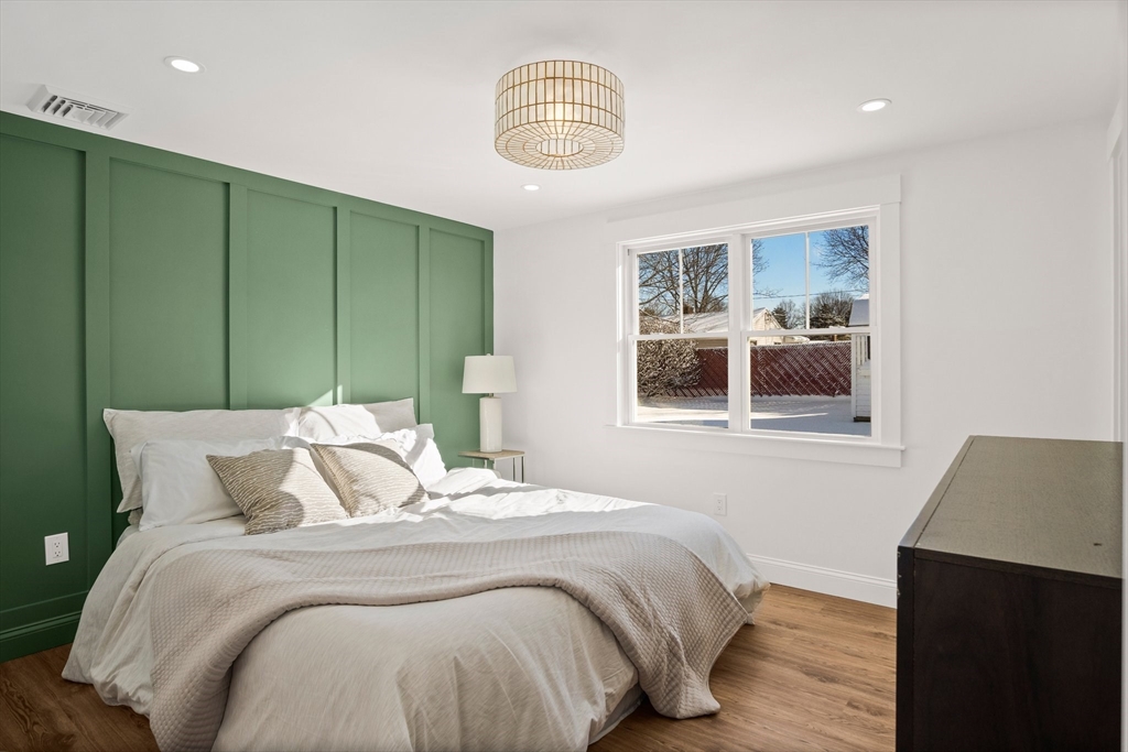 4 Jethro Street Maynard, MA 01754 - Photo 18 of 29 a bedroom with a bed and a window