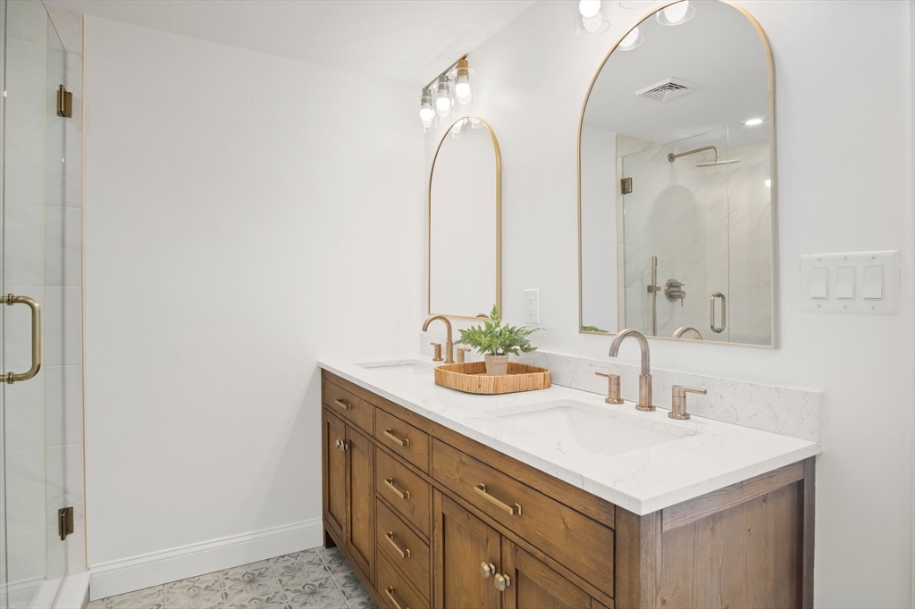 4 Jethro Street Maynard, MA 01754 - Photo 21 of 29 a bathroom with a sink and a mirror