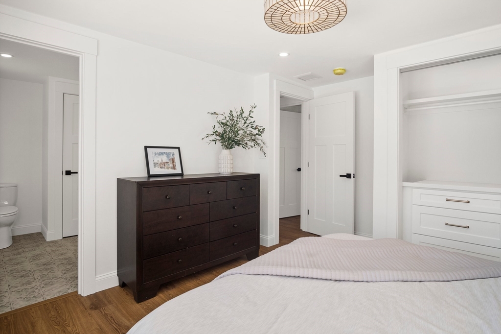 4 Jethro Street Maynard, MA 01754 - Photo 22 of 29 a bedroom with a bed and a dresser