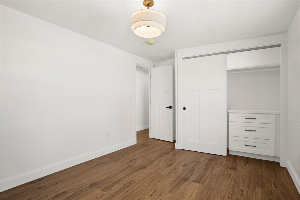 4 Jethro Street Maynard, MA 01754 - Photo 24 of 29 wooden floor in an empty room