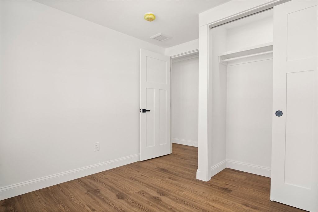 4 Jethro Street Maynard, MA 01754 - Photo 26 of 29 a view of an empty room with wooden floor and closet