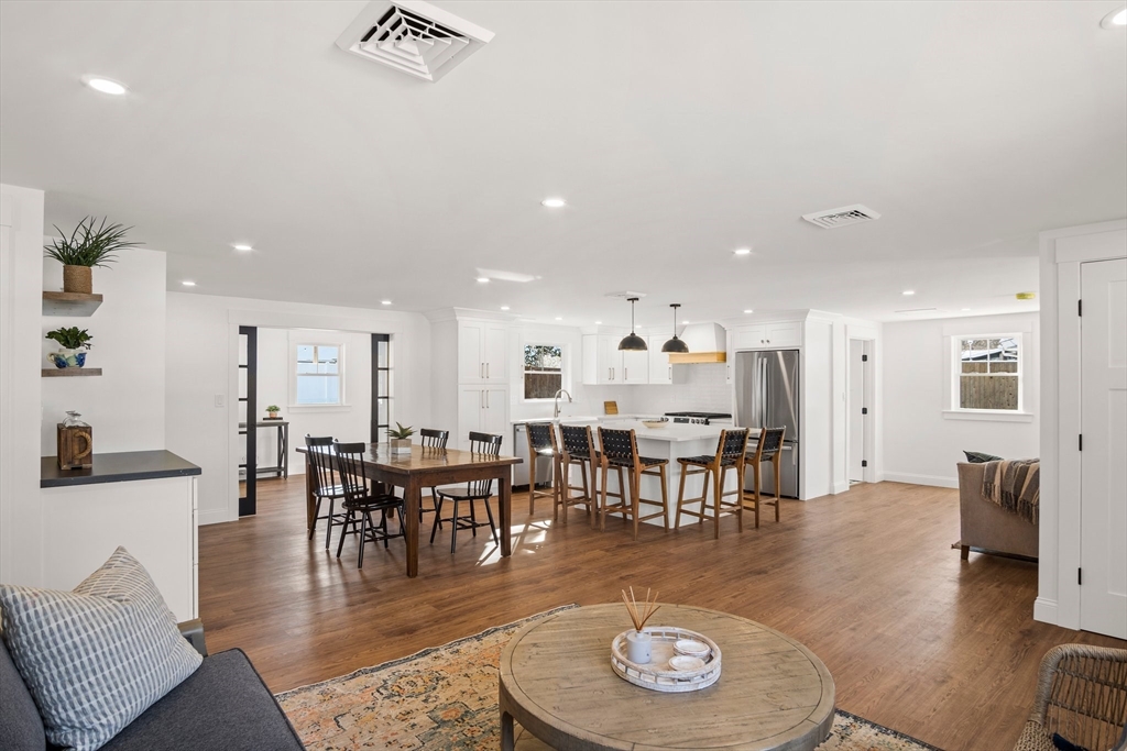 4 Jethro Street Maynard, MA 01754 - Photo 5 of 29 a living room with furniture a dining table and chairs