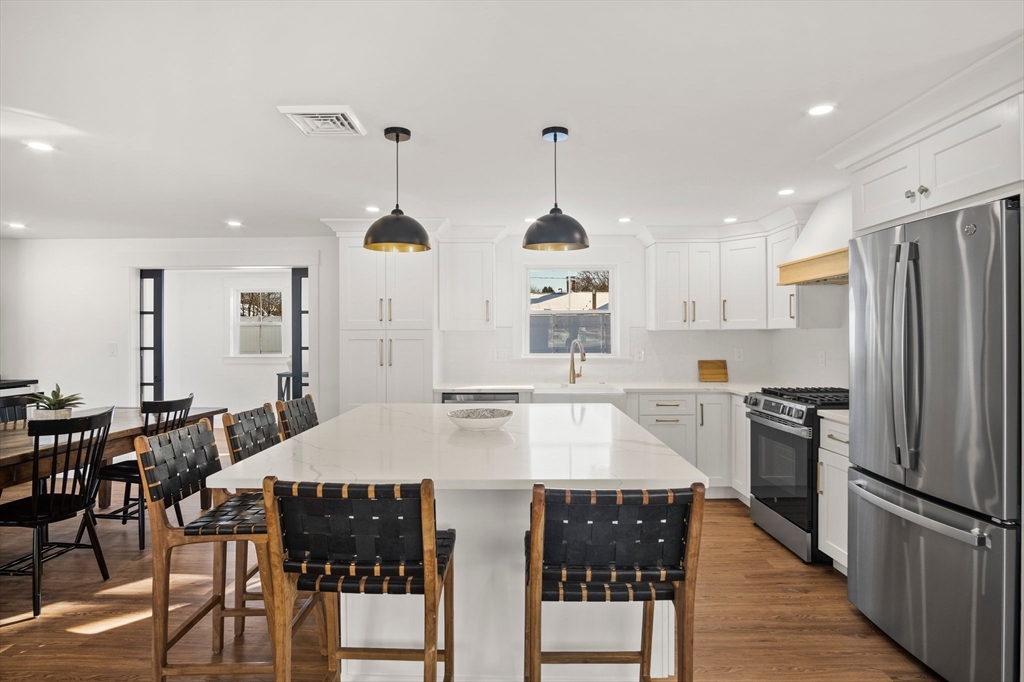 4 Jethro Street Maynard, MA 01754 - Photo 7 of 29 a large kitchen with a table and chairs