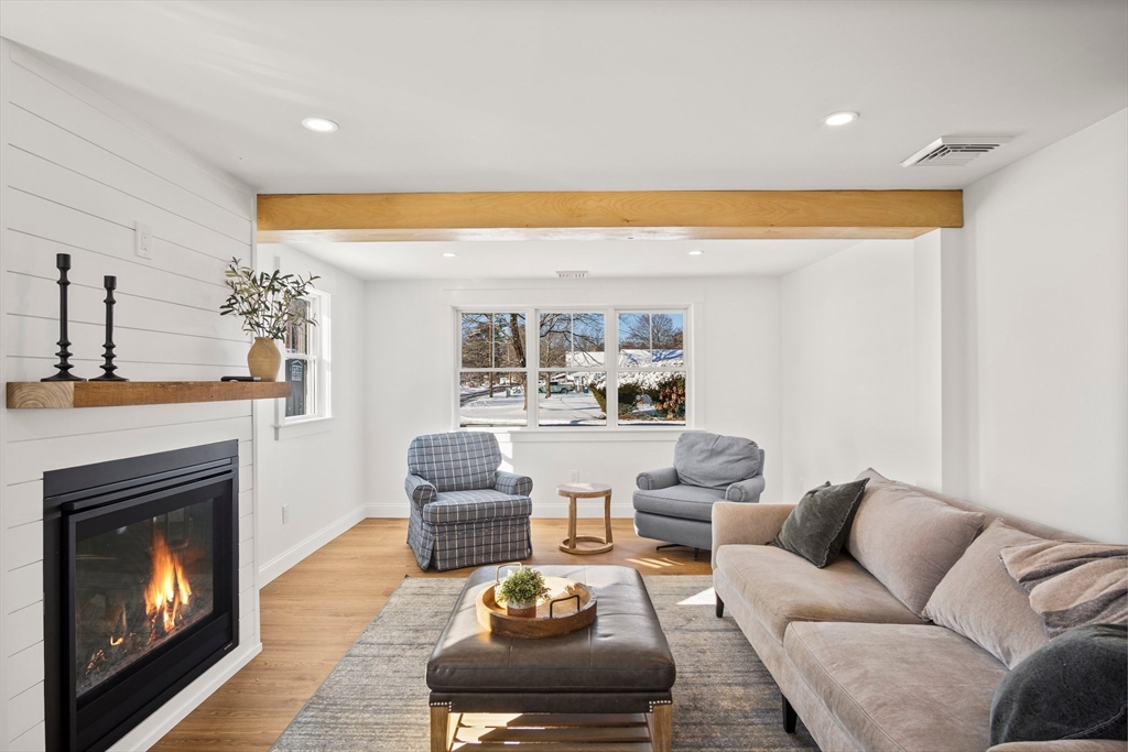 4 Jethro Street Maynard, MA 01754 - Photo 9 of 29 a living room with furniture and a fireplace
