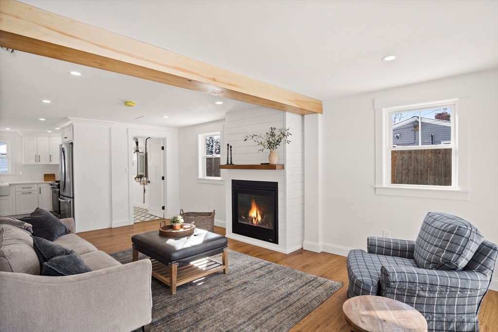 4 Jethro Street Maynard, MA 01754 - Photo 10 of 29 a living room with furniture and a fireplace