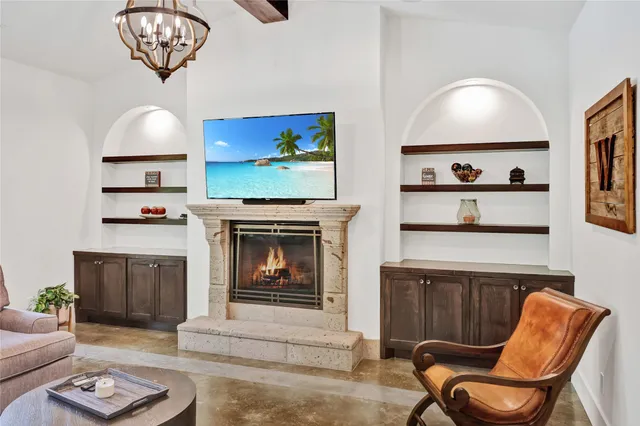 a living room with furniture and a fireplace