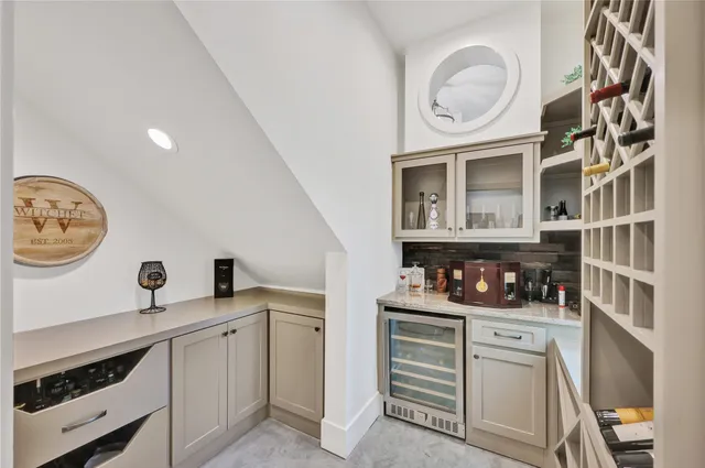 a kitchen with cabinets and window