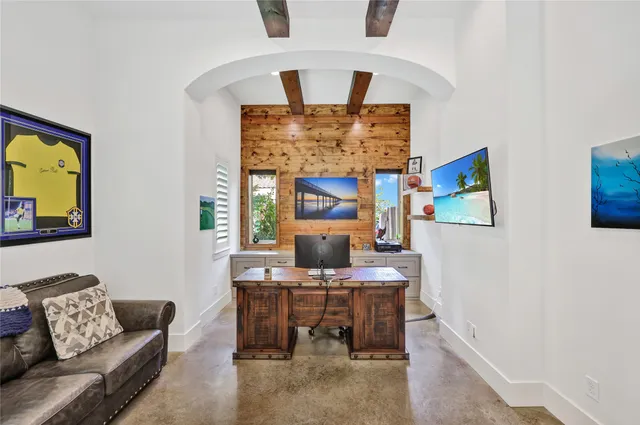 a view of a hallway with wooden floor and a livingroom view