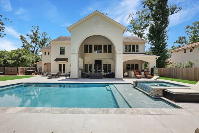 a view of swimming pool with sitting area