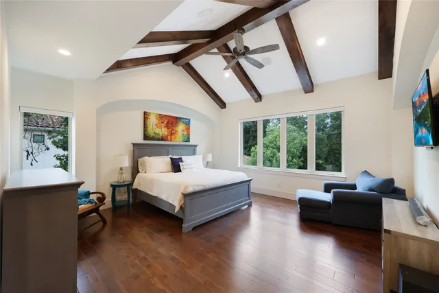 a bedroom with furniture and a bed