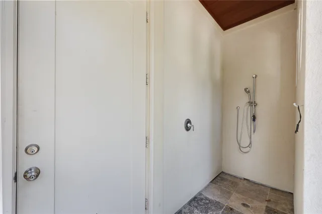 a bathroom with a sink toilet and a mirror