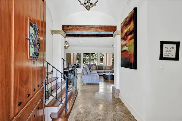 a view of entryway livingroom and hall with wooden floor