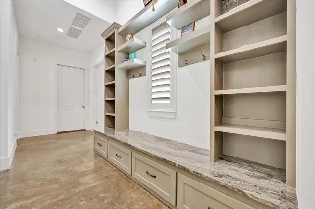 a view of an empty walk in closet