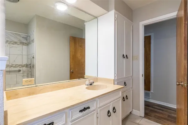 a bathroom with a sink and a mirror
