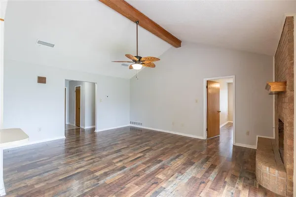 a kitchen with stainless steel appliances granite countertop a stove refrigerator and cabinets