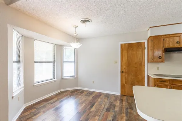 a spacious bathroom with a double vanity sink a mirror and a bathtub