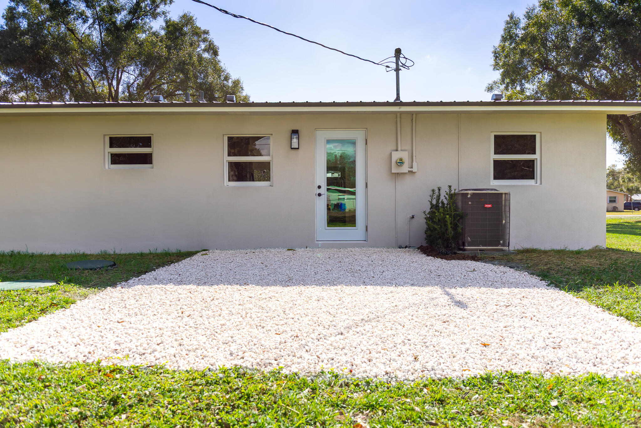 1008 Southwest 10th Street Okeechobee, FL 34974 - Photo 18 of 41 a front view of a house with garden