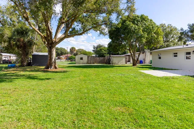 a view of a tree in front of a house