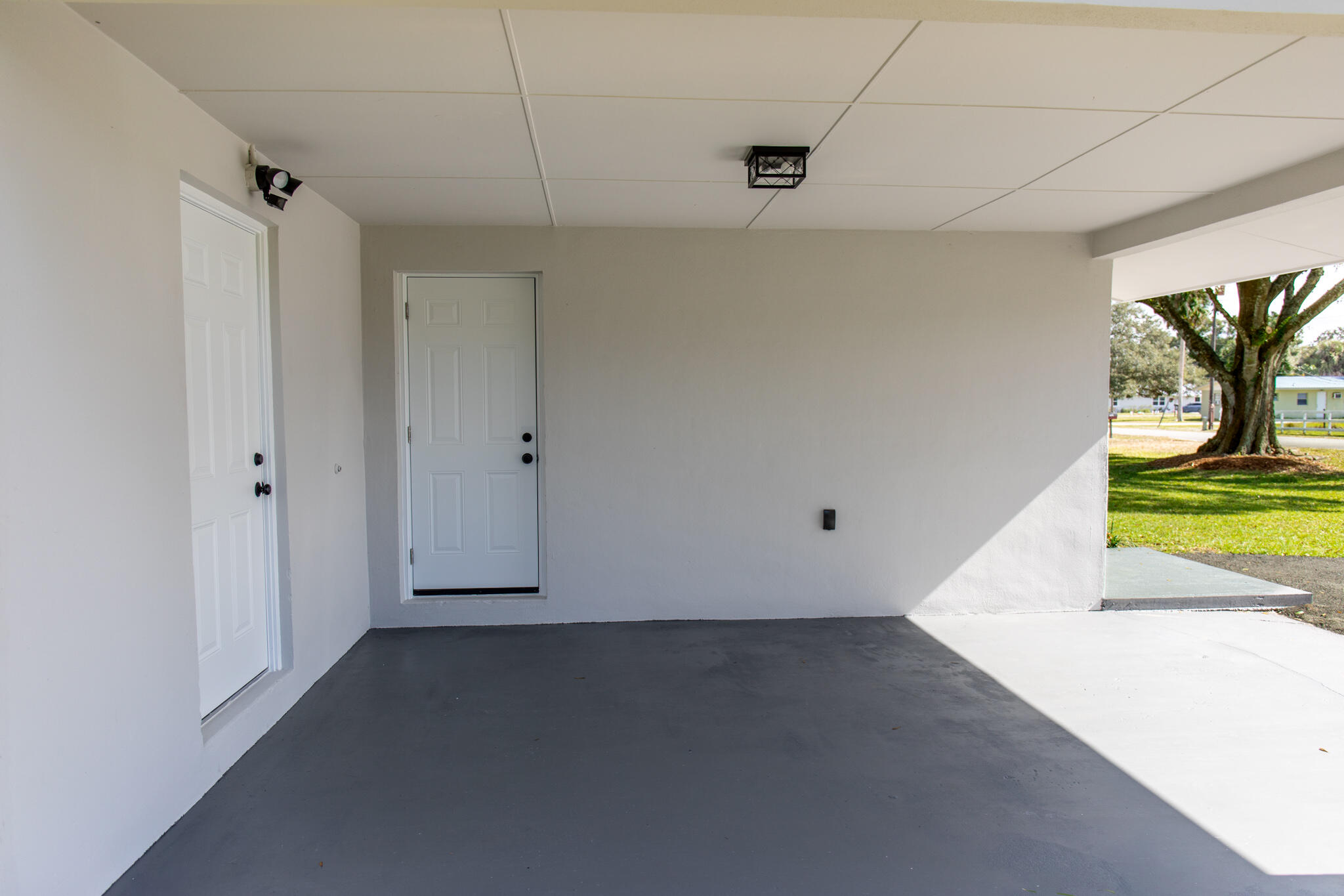 1008 Southwest 10th Street Okeechobee, FL 34974 - Photo 26 of 41 a view of room with window and a ceiling fan