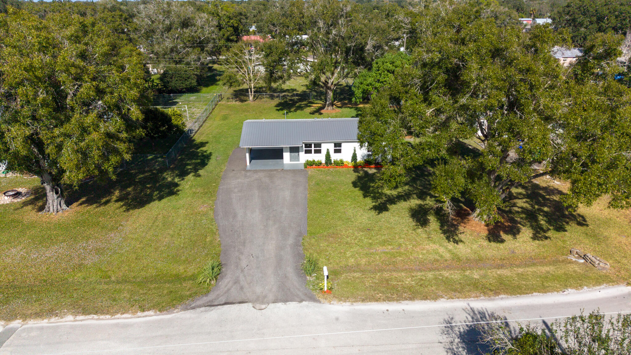 1008 Southwest 10th Street Okeechobee, FL 34974 - Photo 27 of 41 a view of a house with a yard