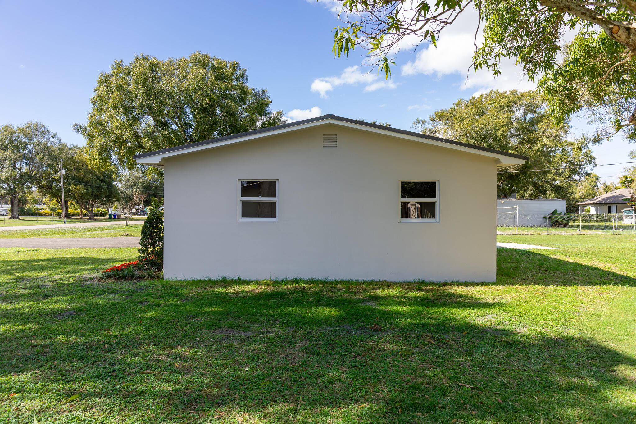 1008 Southwest 10th Street Okeechobee, FL 34974 - Photo 37 of 41 a view of a house with backyard