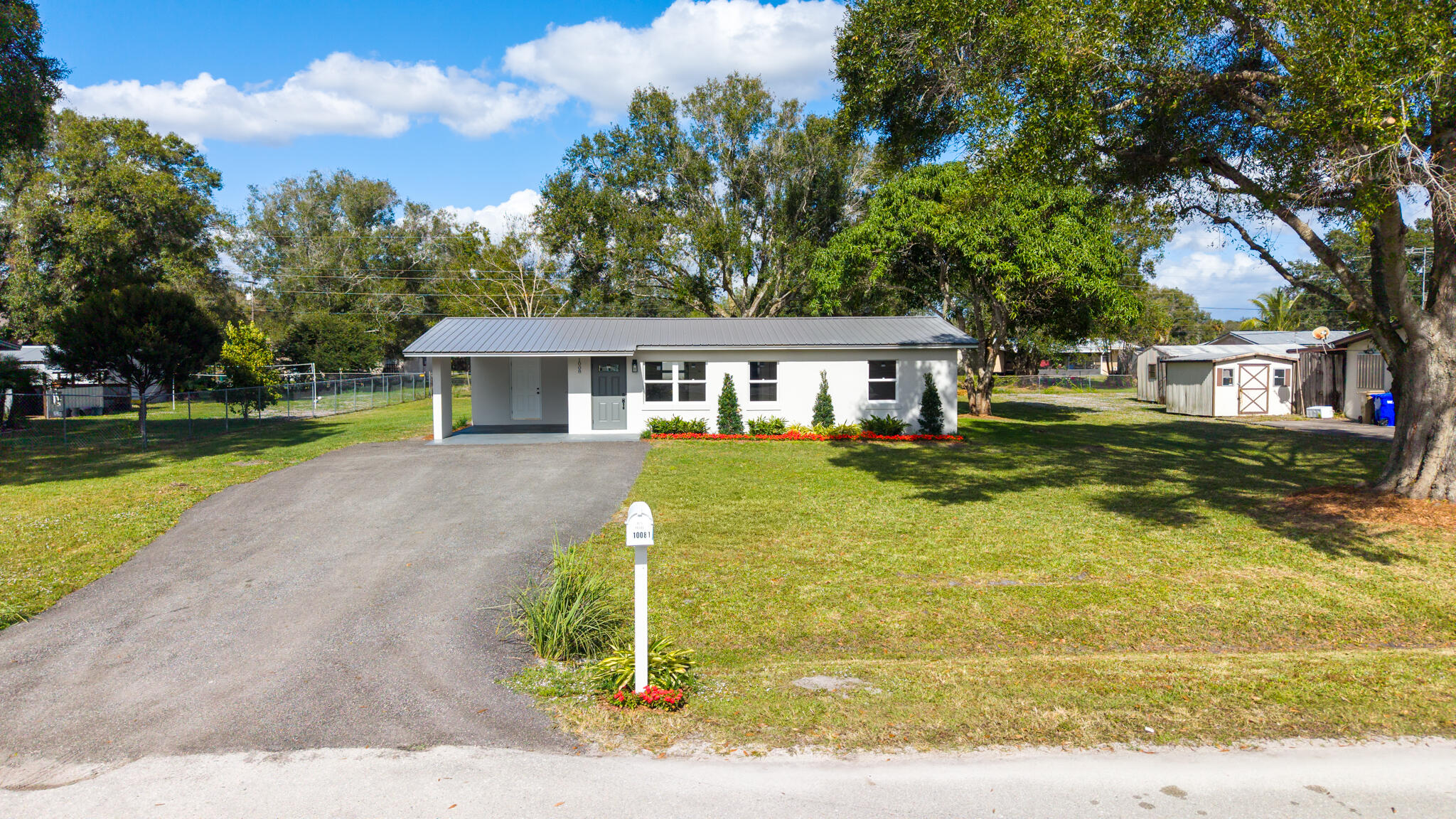 1008 Southwest 10th Street Okeechobee, FL 34974 - Photo 38 of 41 a view of a house with a swimming pool