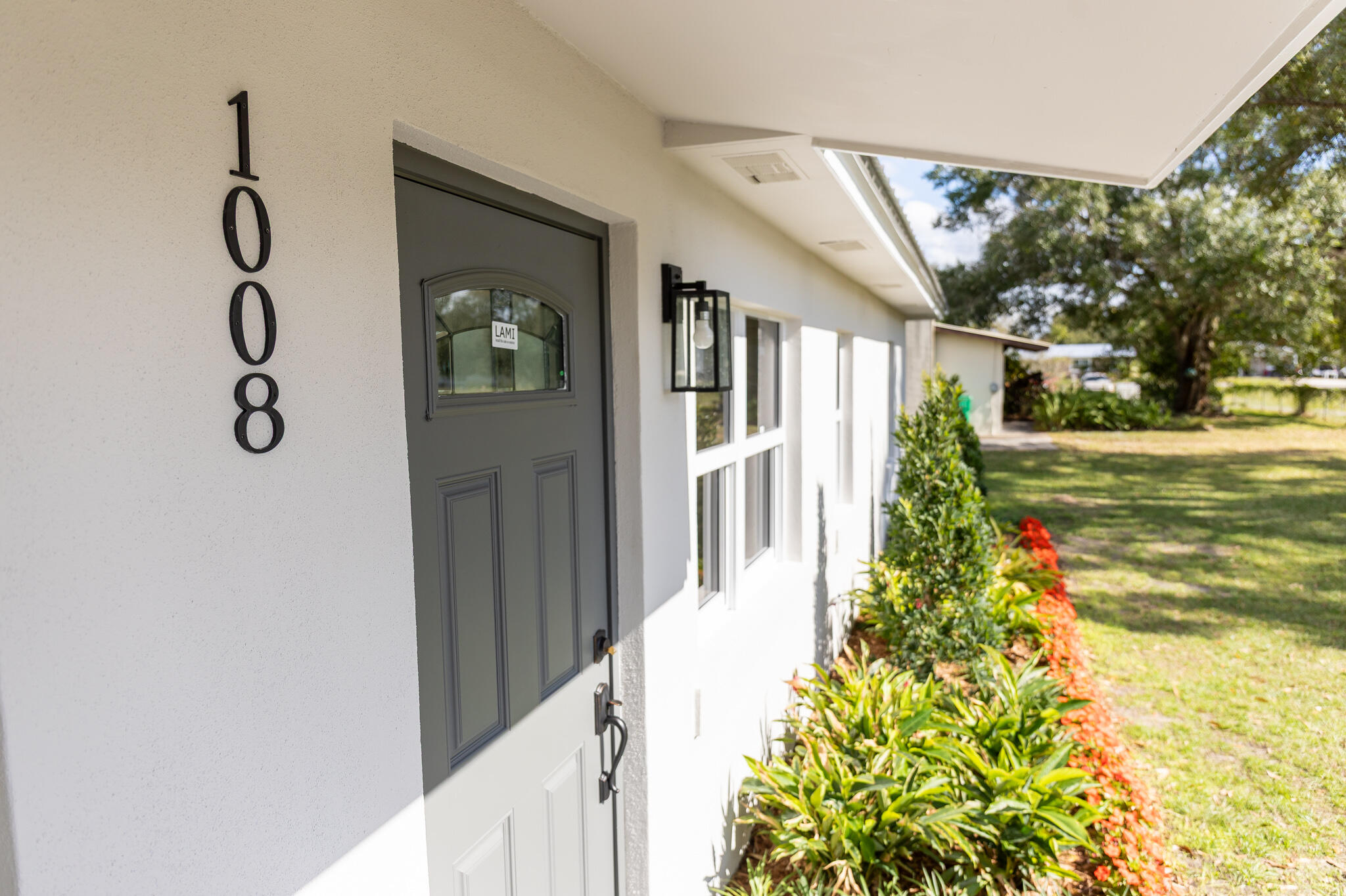 1008 Southwest 10th Street Okeechobee, FL 34974 - Photo 39 of 41 a front view of a house with garden