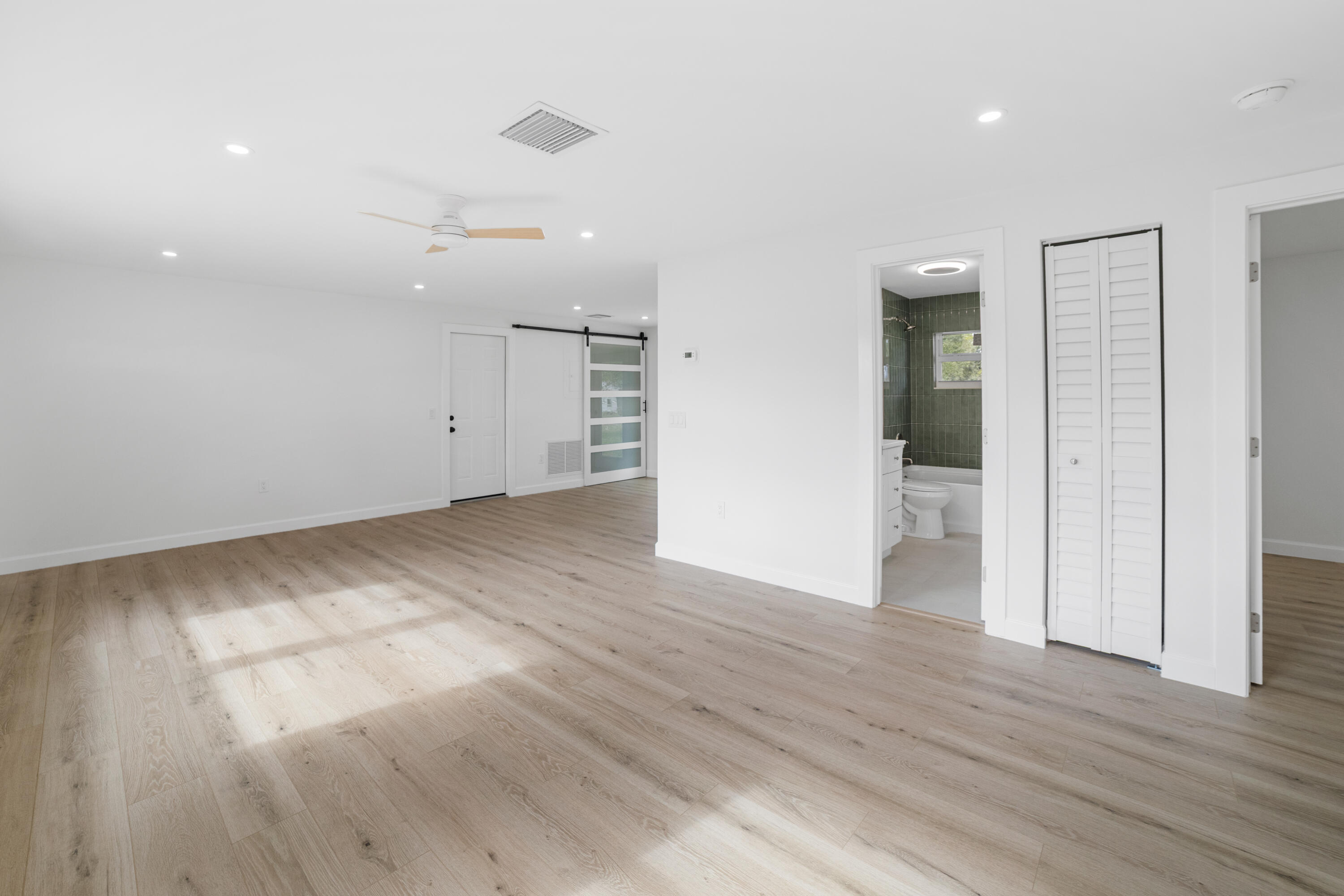 1008 Southwest 10th Street Okeechobee, FL 34974 - Photo 4 of 41 a view of empty room with wooden floor