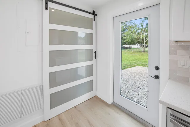 a view of an empty room with a window