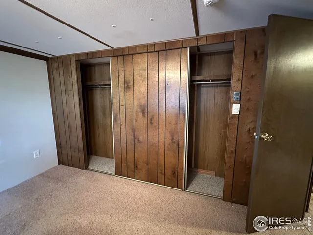a bathroom with a sink a toilet a mirror and shower