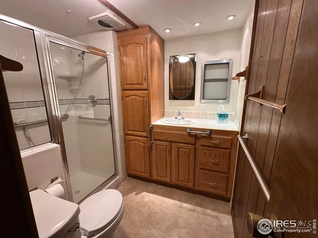 a view of a house with a yard and wooden fence
