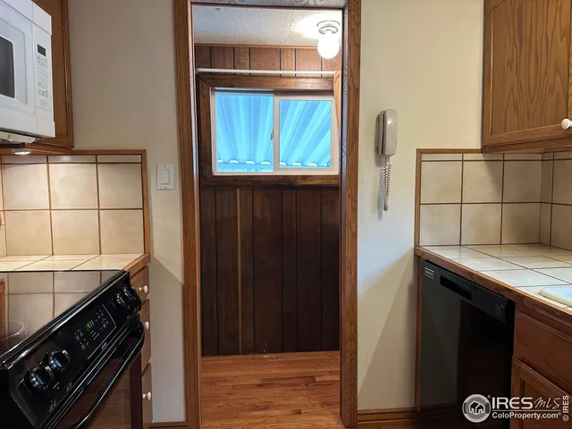 a kitchen that has a stove and a microwave