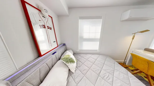 a bed room with a bed and a window