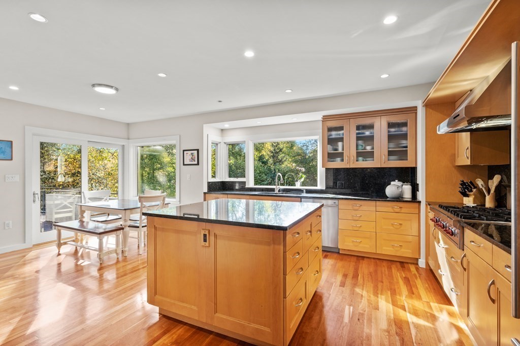 9 Livermore Road Wellesley, MA 02481 - Photo 6 of 20 a large kitchen with a large window and wooden floor