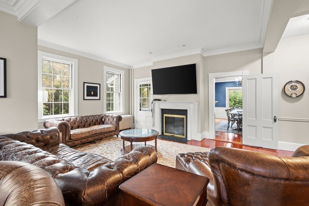 9 Livermore Road Wellesley, MA 02481 - Photo 8 of 20 a living room with furniture a fireplace and a flat screen tv