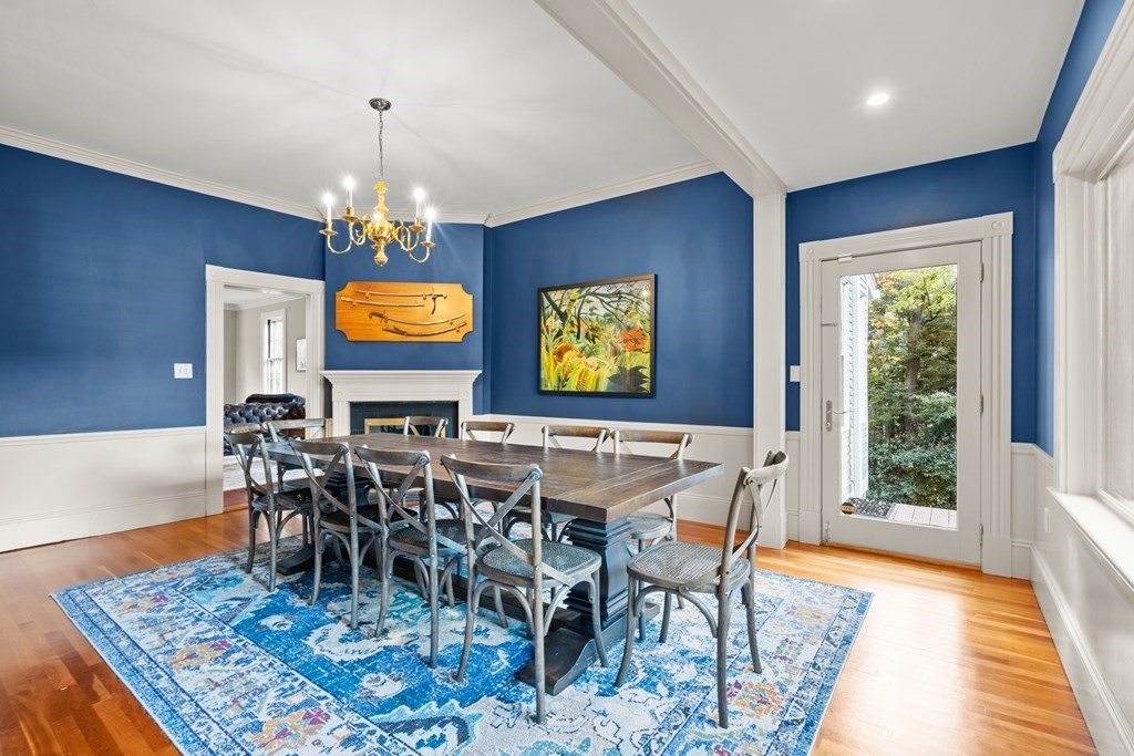 9 Livermore Road Wellesley, MA 02481 - Photo 10 of 20 a view of a dining room and livingroom with furniture wooden floor a rug and a chandelier