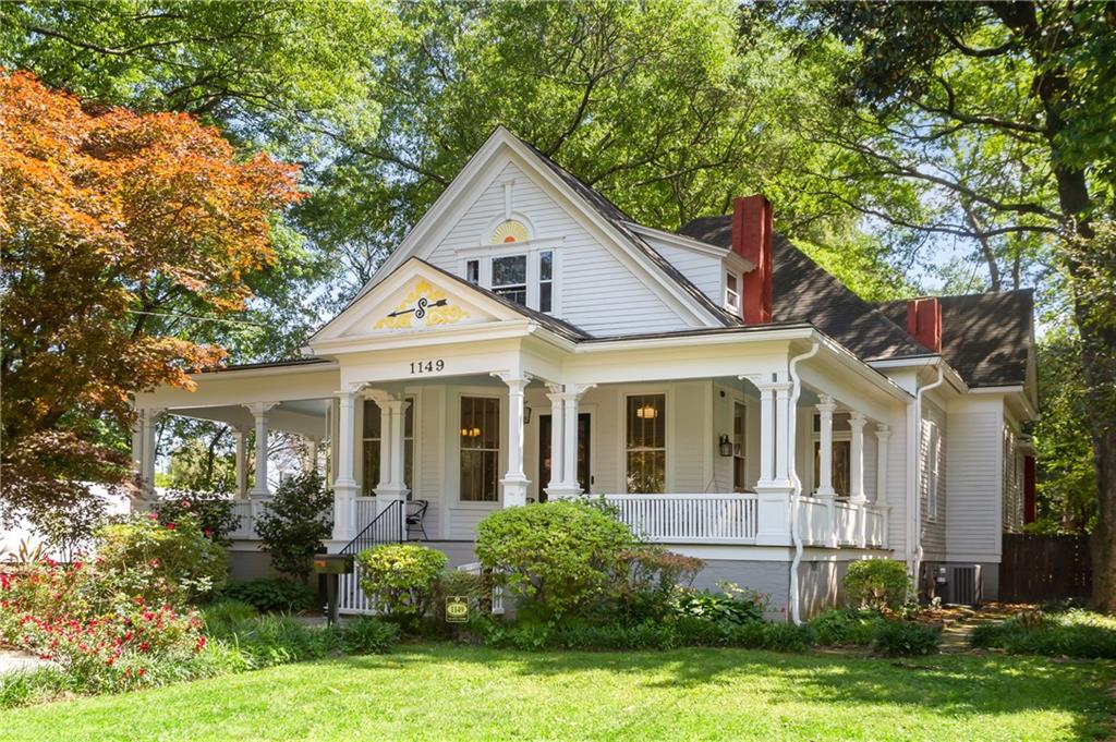 1149 Austin Avenue Northeast Atlanta, GA 30307 - Photo 1 of 1 a front view of a house with a yard and potted plants