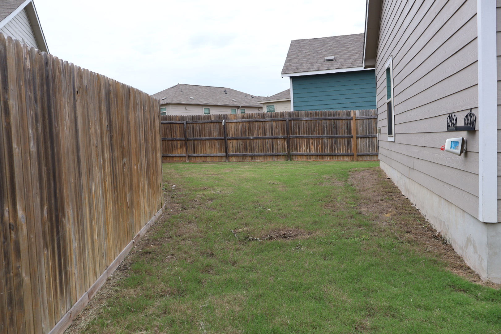 117 Galaxy Way Jarrell, TX 76537 - Photo 16 of 17 Expansive backyard featuring a manicured lawn and perimeter fencing