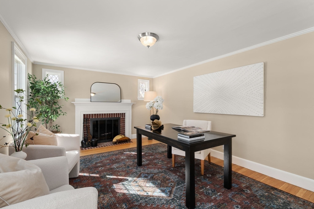 6 Boulder Brook Road Wellesley, MA 02481 - Photo 16 of 34 a living room with furniture a fireplace and a table