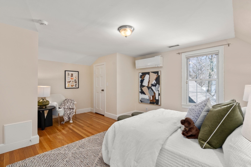 6 Boulder Brook Road Wellesley, MA 02481 - Photo 21 of 34 a bedroom with a bed and wooden floor