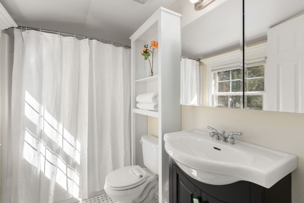 6 Boulder Brook Road Wellesley, MA 02481 - Photo 24 of 34 a bathroom with a sink a toilet and a mirror