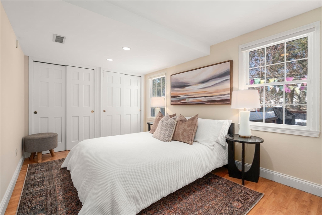 6 Boulder Brook Road Wellesley, MA 02481 - Photo 25 of 34 a bedroom with a bed and wooden floor
