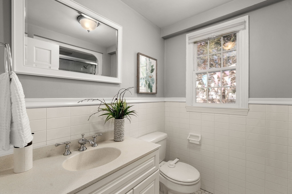 6 Boulder Brook Road Wellesley, MA 02481 - Photo 26 of 34 a bathroom with a sink toilet a mirror and shower