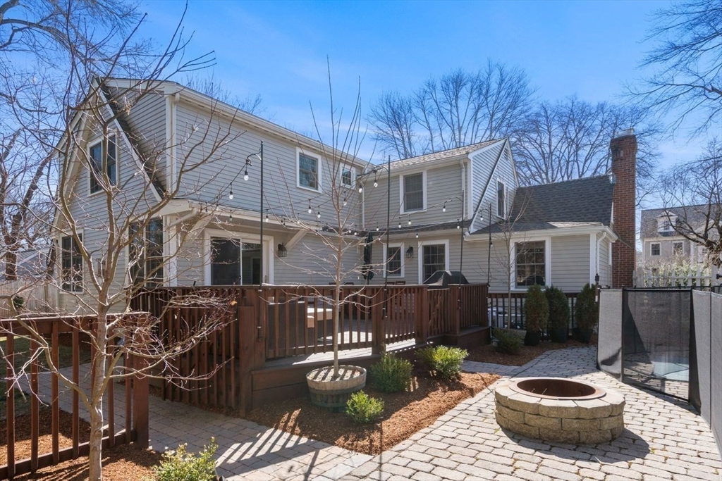 6 Boulder Brook Road Wellesley, MA 02481 - Photo 30 of 34 a view of a patio with table and chairs and potted plants