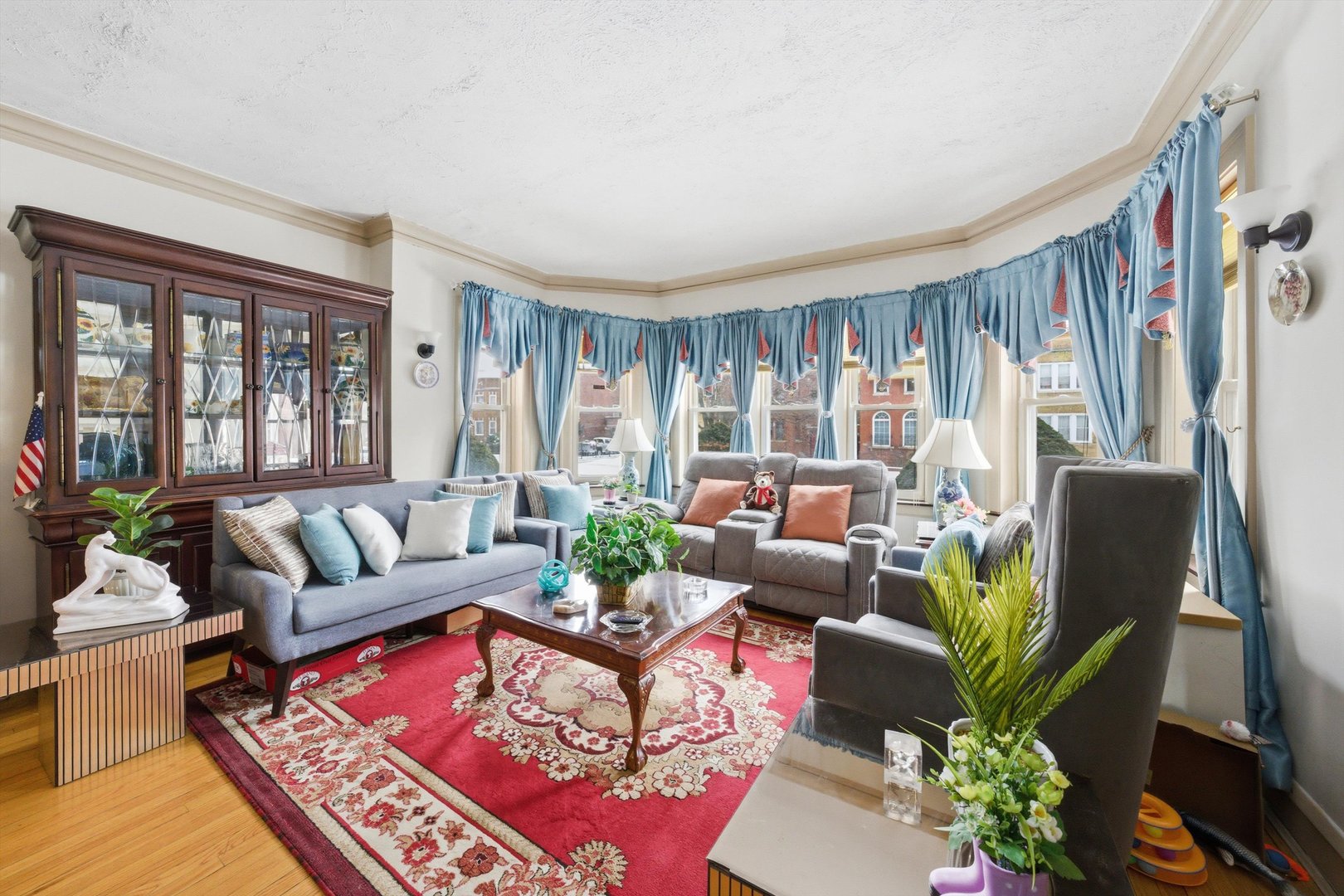 8019 South Rhodes Avenue Chicago, IL 60619 - Photo 3 of 55 a living room with furniture potted plant and a large window