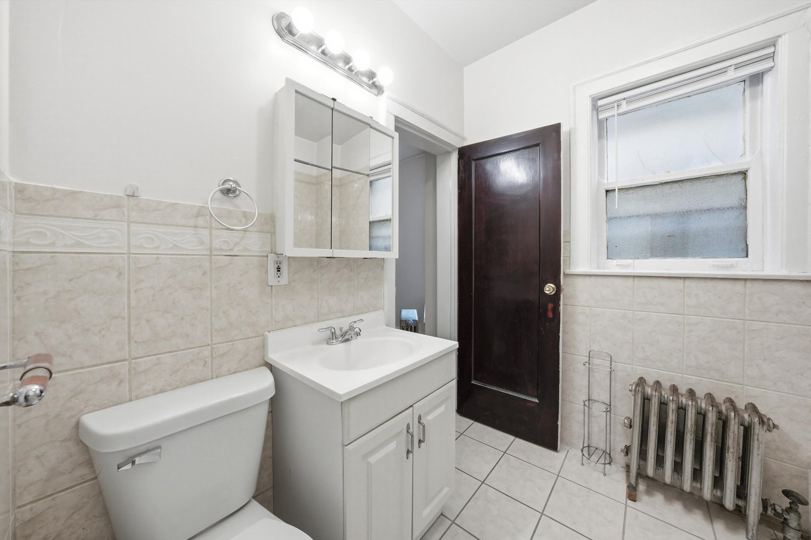 8019 South Rhodes Avenue Chicago, IL 60619 - Photo 41 of 55 a bathroom with a sink toilet and shower