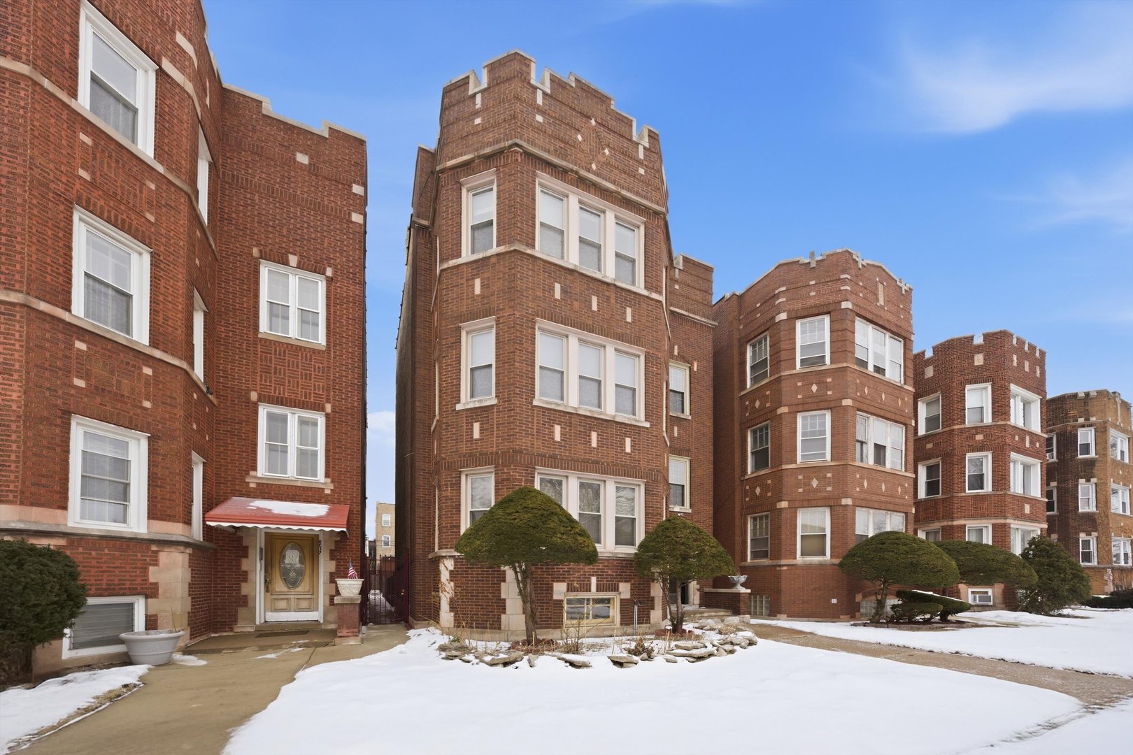 8019 South Rhodes Avenue Chicago, IL 60619 - Photo 47 of 55 a front view of a building with lot of cars and trees