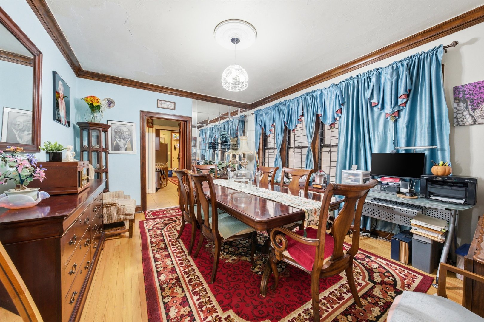 8019 South Rhodes Avenue Chicago, IL 60619 - Photo 5 of 55 a view of a dining room with furniture window and wooden floor